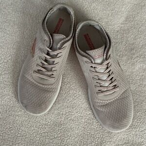 Skechers Goga Max cream slip ons.